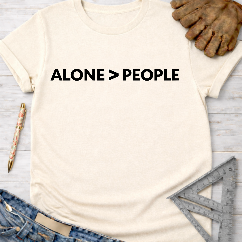Women's funny woodworking graphic tee shirt for female woodworkers, makers, and DIY builders — Sawdust & Ponytails. Cream t-shirt with "ALONE > PEOPLE" in black text.