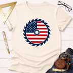 Cream t-shirt with an American flag saw blade graphic, perfect for woodworkers and DIYers.