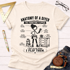 Women's funny woodworking graphic tee shirt for female woodworkers, makers, and DIY builders — Sawdust & Ponytails. Cream t-shirt with "Anatomy of a DIYer The Furniture Flipper" graphic.