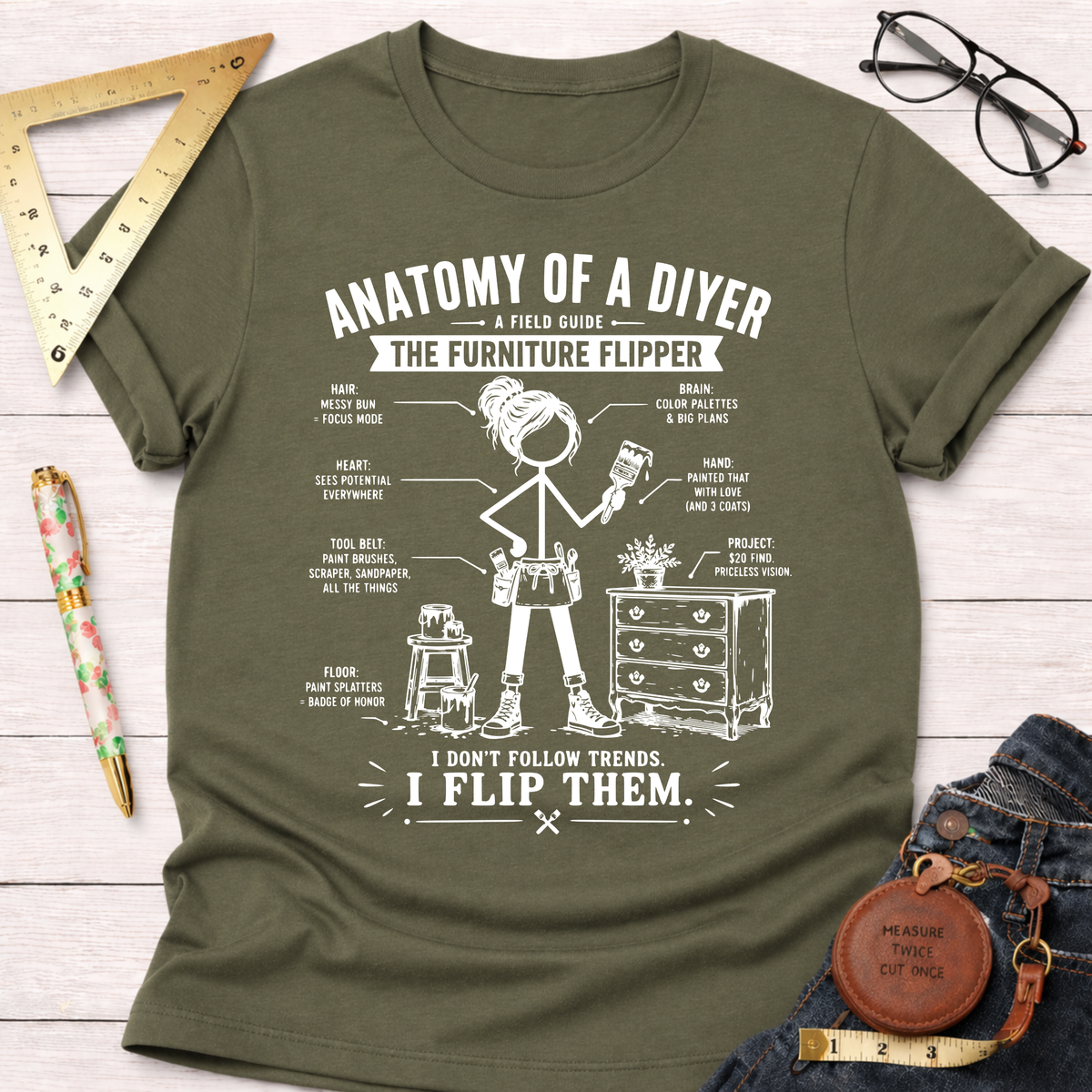 Women's funny woodworking graphic tee shirt for female woodworkers, makers, and DIY builders — Sawdust & Ponytails. Olive green cotton tee with "Anatomy of a DIYer The Furniture Flipper" white graphic.
