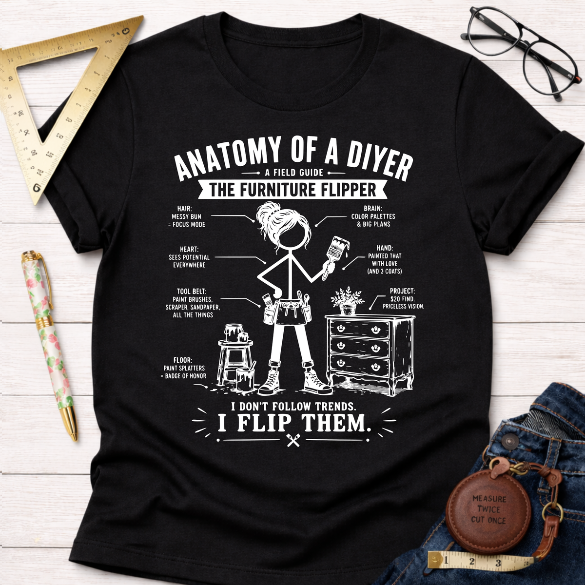 Women's funny woodworking graphic tee shirt for female woodworkers, makers, and DIY builders — Sawdust & Ponytails. Black cotton tee with "Anatomy of a DIYer The Furniture Flipper" graphic.