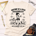 Women's funny woodworking graphic tee shirt for female woodworkers, makers, and DIY builders — Sawdust & Ponytails. Cream t-shirt with "Anatomy of a DIYer" graphic.