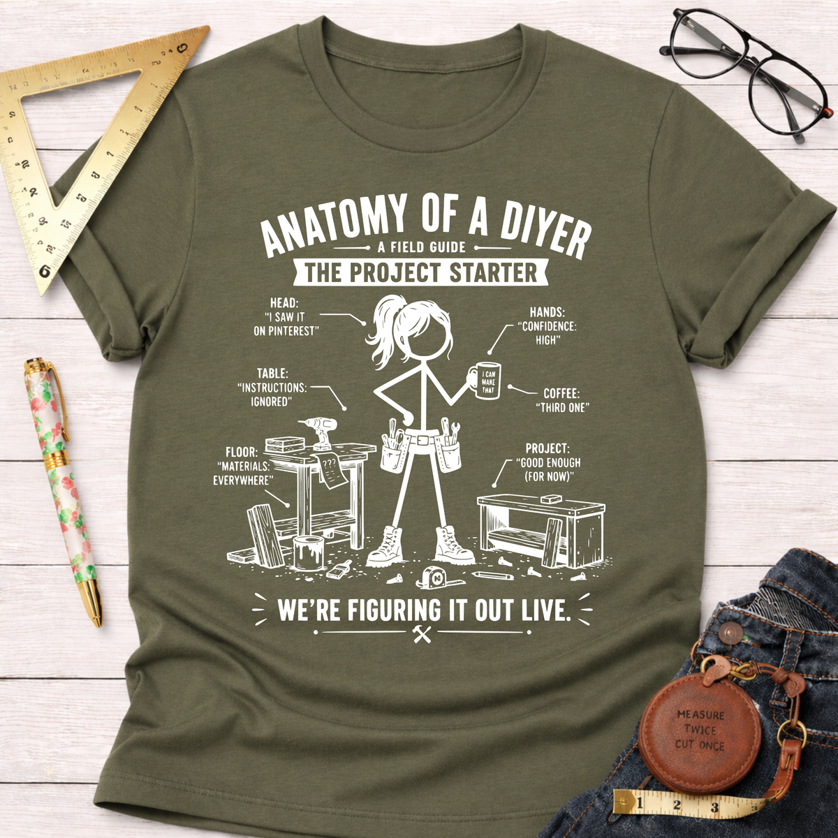 Women's funny woodworking graphic tee shirt for female woodworkers, makers, and DIY builders — Sawdust & Ponytails. Olive green short-sleeve t-shirt with white "Anatomy of a DIYer" graphic.