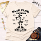 Women's funny woodworking graphic tee shirt for female woodworkers, makers, and DIY builders — Sawdust & Ponytails. Cream t-shirt with "Anatomy of a DIYer: The Tool Buyer" graphic.