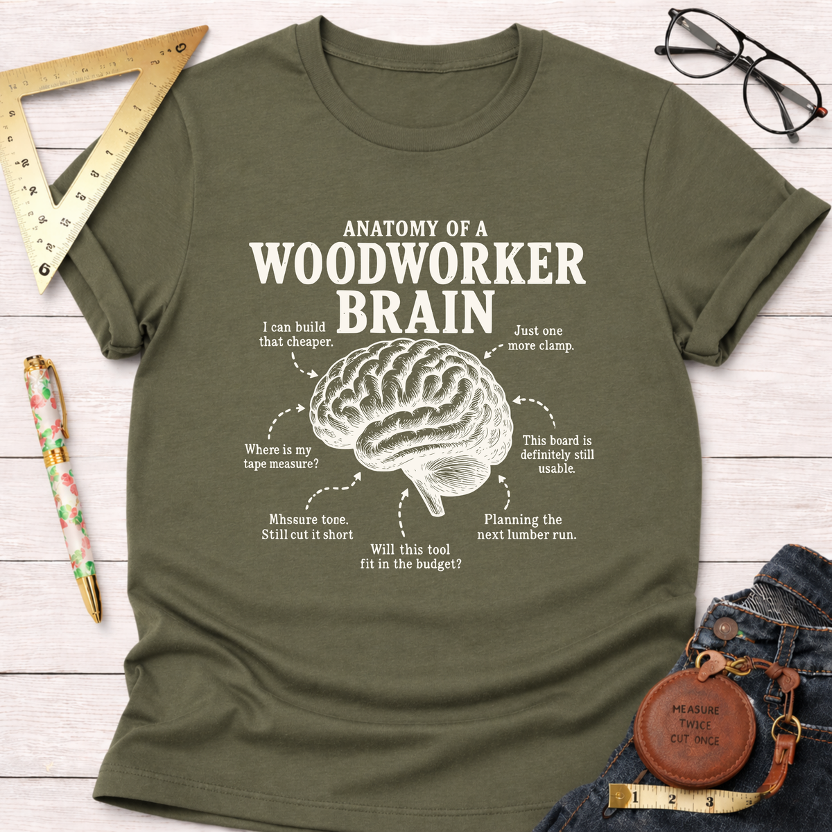 Olive green t-shirt with "Anatomy of a Woodworker Brain" graphic and humorous woodworking thoughts.