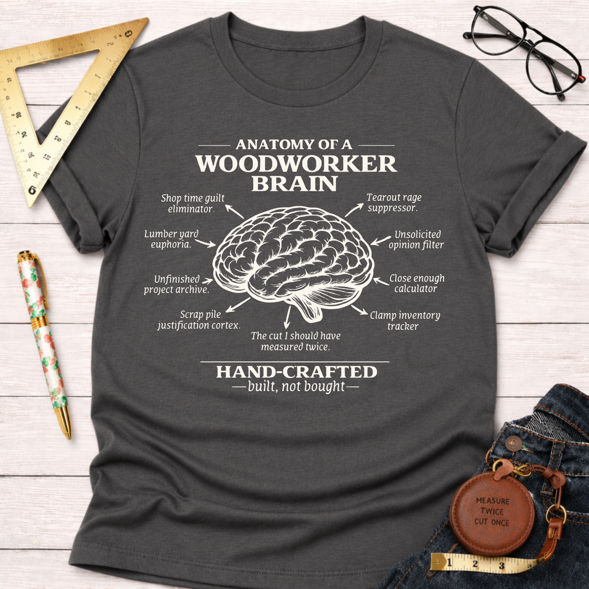 Charcoal gray women's funny woodworking graphic tee shirt with "Anatomy of a Woodworker Brain" design. Sawdust & Ponytails.