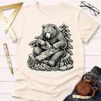 Women's funny woodworking graphic tee shirt for female woodworkers, makers, and DIY builders — Sawdust & Ponytails. Cream cotton t-shirt with a black graphic of a bear planing wood.