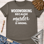 Women's funny woodworking graphic tee shirt for female woodworkers, makers, and DIY builders — Sawdust & Ponytails. Dark gray t-shirt with "Woodworking Because Murder Is Wrong" in white text.