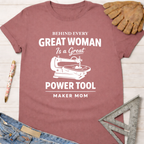 Women's funny woodworking graphic tee shirt for female woodworkers, makers, and DIY builders — Sawdust & Ponytails. Mauve cotton tee with "Behind Every Great Woman Is a Great Power Tool Maker Mom" graphic.