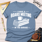 Blue "Board Meeting In The Garage" t-shirt with wood planks, coffee mug, and pencil graphic.