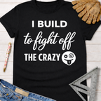 Black women's funny woodworking graphic tee shirt "I Build to Fight Off The Crazy" with a crazy emoji, for female woodworkers, makers, and DIY builders — Sawdust & Ponytails