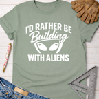Sage green women's funny woodworking graphic tee with "I'd Rather Be Building With Aliens" design.