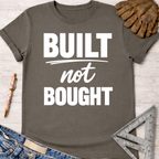 Women's funny woodworking graphic tee shirt for female woodworkers, makers, and DIY builders — Sawdust & Ponytails. Dark gray cotton tee with "BUILT not BOUGHT" in white text.