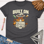 Women's funny woodworking graphic tee shirt for female woodworkers, makers, and DIY builders — Sawdust & Ponytails. Dark gray t-shirt with "Built On Skill & Strong Coffee" graphic.