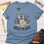 Light blue cotton t-shirt with a graphic of Lady Liberty holding a hammer, "Built To Last" text.