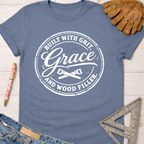 Women's funny woodworking graphic tee shirt for female woodworkers, makers, and DIY builders — Sawdust & Ponytails. Blue cotton tee with "Built With Grit, Grace, and Wood Filler" graphic.