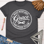 Women's charcoal gray cotton tee with "Built With Grit, Grace, And Wood Filler" graphic. Sawdust & Ponytails.