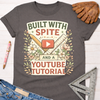 Charcoal gray women's "Built With Spite And A YouTube Tutorial" graphic tee with floral, ruler, and pencil design. Women's funny woodworking graphic tee shirt for female woodworkers, makers, and DIY builders — Sawdust & Ponytails