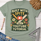 Sage green cotton tee with "Built With Spite And A YouTube Tutorial" graphic. Women's funny woodworking graphic tee shirt for female woodworkers, makers, and DIY builders — Sawdust & Ponytails.