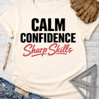Women's funny woodworking graphic tee shirt for female woodworkers, makers, and DIY builders — Sawdust & Ponytails. Cream t-shirt with "Calm Confidence Sharp Skills" text.