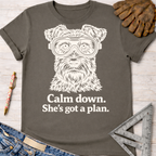 Women's funny woodworking graphic tee shirt for female woodworkers, makers, and DIY builders — Sawdust & Ponytails. Charcoal gray cotton tee with a white graphic of a dog wearing safety goggles and "Calm down. She's got a plan.