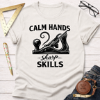 Calm Hands Sharp Skills T-shirt in cream with a black woodworking plane graphic, surrounded by tools.