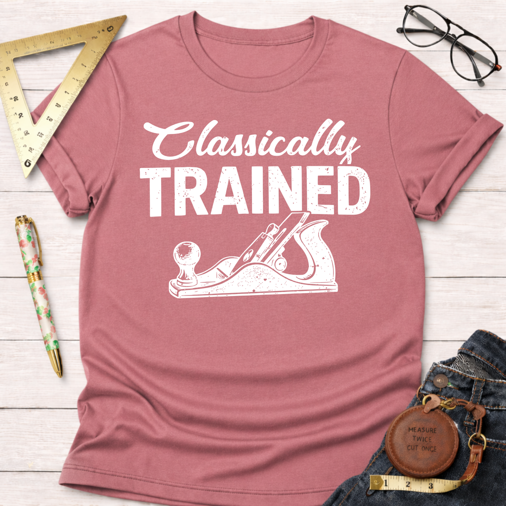 Women's funny woodworking graphic tee shirt for female woodworkers, makers, and DIY builders — Sawdust & Ponytails. Dusty rose cotton tee with "Classically Trained" and hand plane graphic.