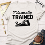 Women's funny woodworking graphic tee shirt for female woodworkers, makers, and DIY builders — Sawdust & Ponytails. Cream cotton tee with "Classically TRAINED" and a hand plane graphic.