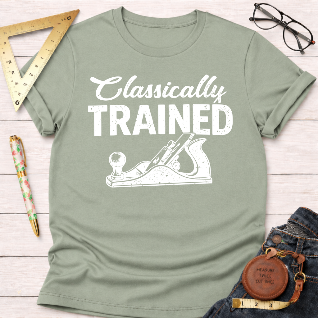 Women's funny woodworking graphic tee shirt for female woodworkers, makers, and DIY builders — Sawdust & Ponytails. Sage green cotton tee with "Classically Trained" and hand plane graphic.