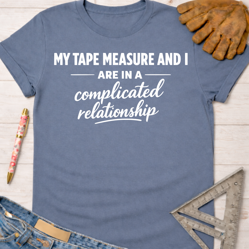 Women's funny woodworking graphic tee shirt for female woodworkers, makers, and DIY builders — Sawdust & Ponytails. Blue cotton tee with "My Tape Measure and I are in a complicated relationship" text.