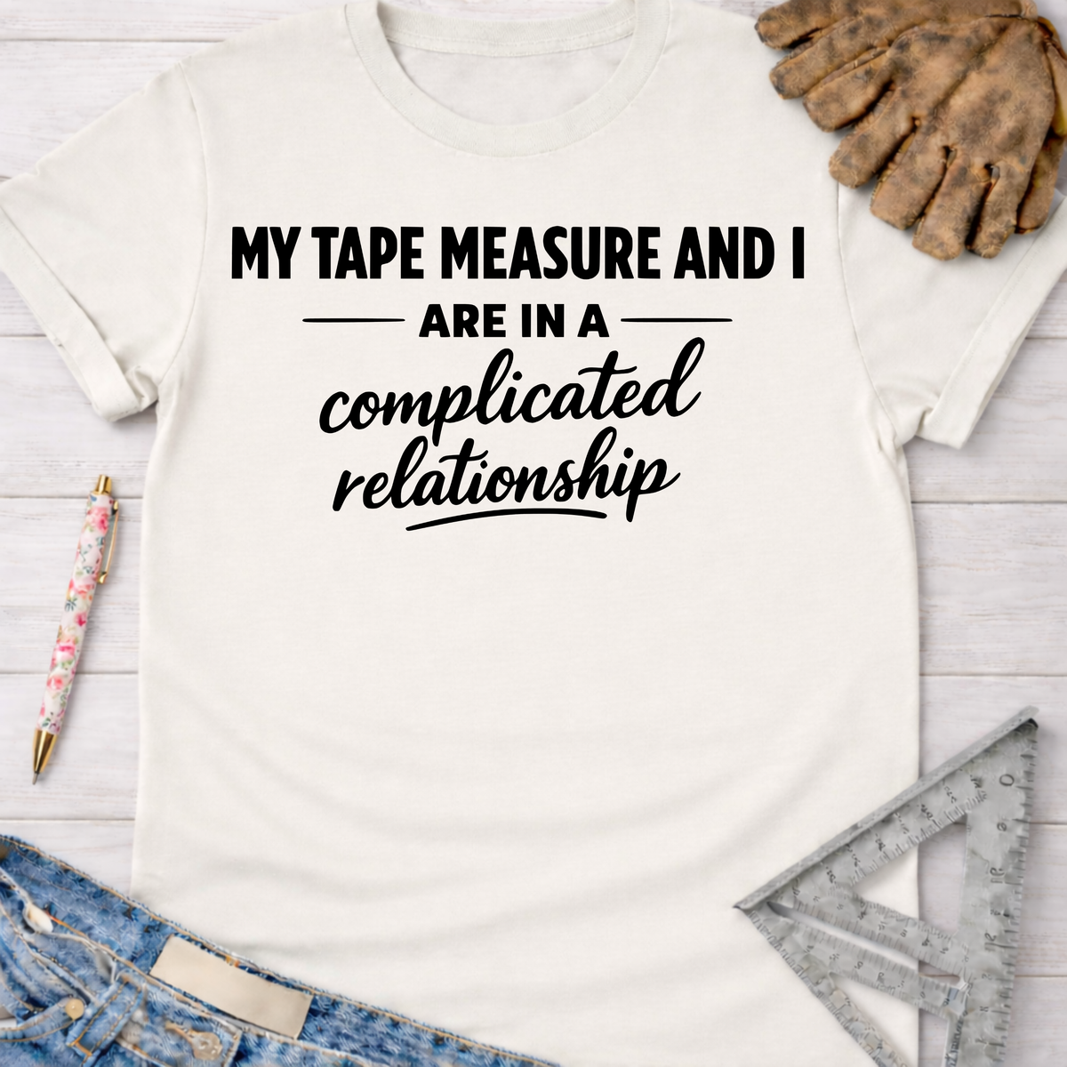 White cotton tee with "My Tape Measure And I Are In A Complicated Relationship" text. Women's funny woodworking graphic tee shirt for female woodworkers, makers, and DIY builders — Sawdust & Ponytails.