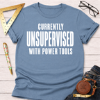 Women's funny woodworking graphic tee shirt for female woodworkers, makers, and DIY builders — Sawdust & Ponytails. Light blue cotton t-shirt with "CURRENTLY UNSUPERVISED WITH POWER TOOLS" in white text.