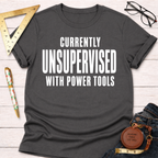 Charcoal gray cotton tee with "CURRENTLY UNSUPERVISED WITH POWER TOOLS" in white. Women's funny woodworking graphic tee shirt for female woodworkers, makers, and DIY builders — Sawdust & Ponytails
