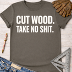 Charcoal gray women's "Cut Wood Take No Shit" graphic tee, with work gloves, jeans, and a ruler. Women's funny woodworking graphic tee shirt for female woodworkers, makers, and DIY builders — Sawdust & Ponytails