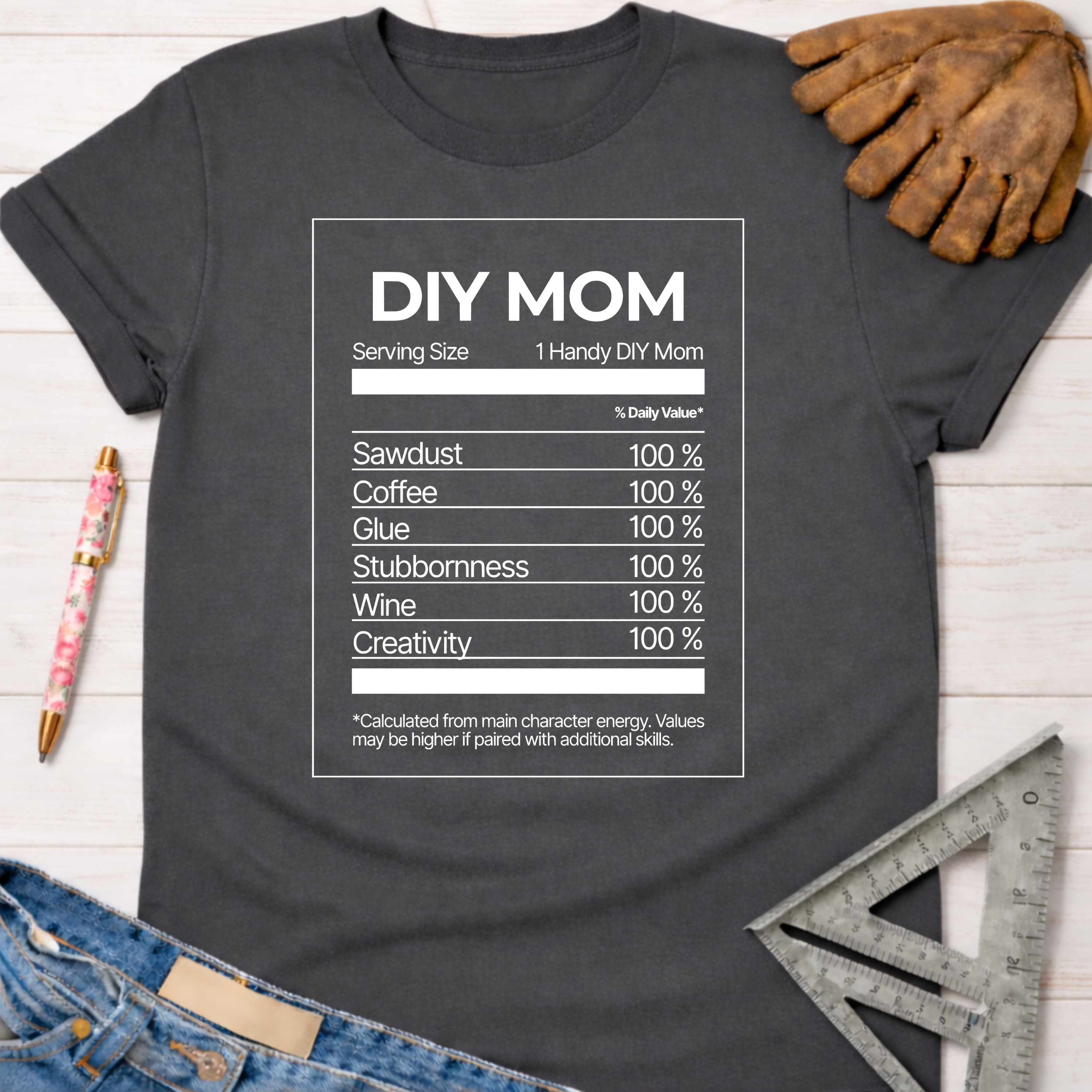 Women's funny woodworking graphic tee shirt for female woodworkers, makers, and DIY builders — Sawdust & Ponytails. Dark gray t-shirt with "DIY MOM Nutrition Facts" graphic.