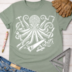 Women's funny woodworking graphic tee shirt for female woodworkers, makers, and DIY builders — Sawdust & Ponytails. Sage green cotton tee with white octopus holding tools.