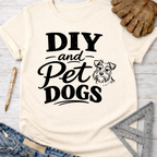 Women's funny woodworking graphic tee shirt for female woodworkers, makers, and DIY builders — Sawdust & Ponytails. Cream t-shirt with "DIY and Pet Dogs" text and a dog graphic.