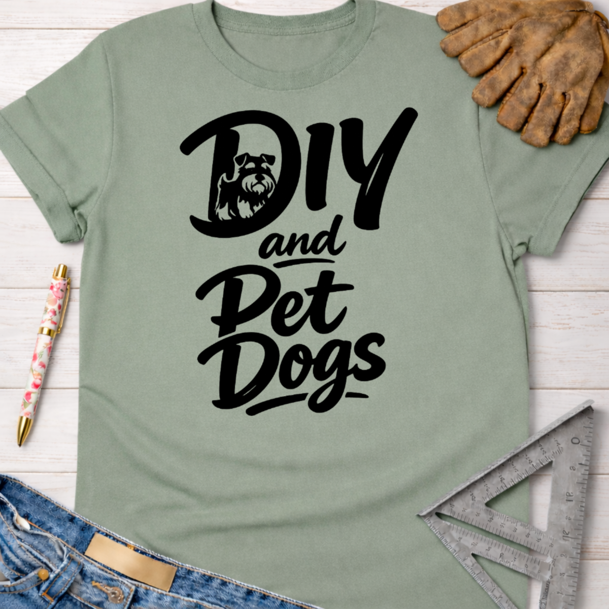 Women's funny woodworking graphic tee shirt for female woodworkers, makers, and DIY builders — Sawdust & Ponytails. Sage green cotton t-shirt with "DIY and Pet Dogs" text and a Schnauzer graphic.