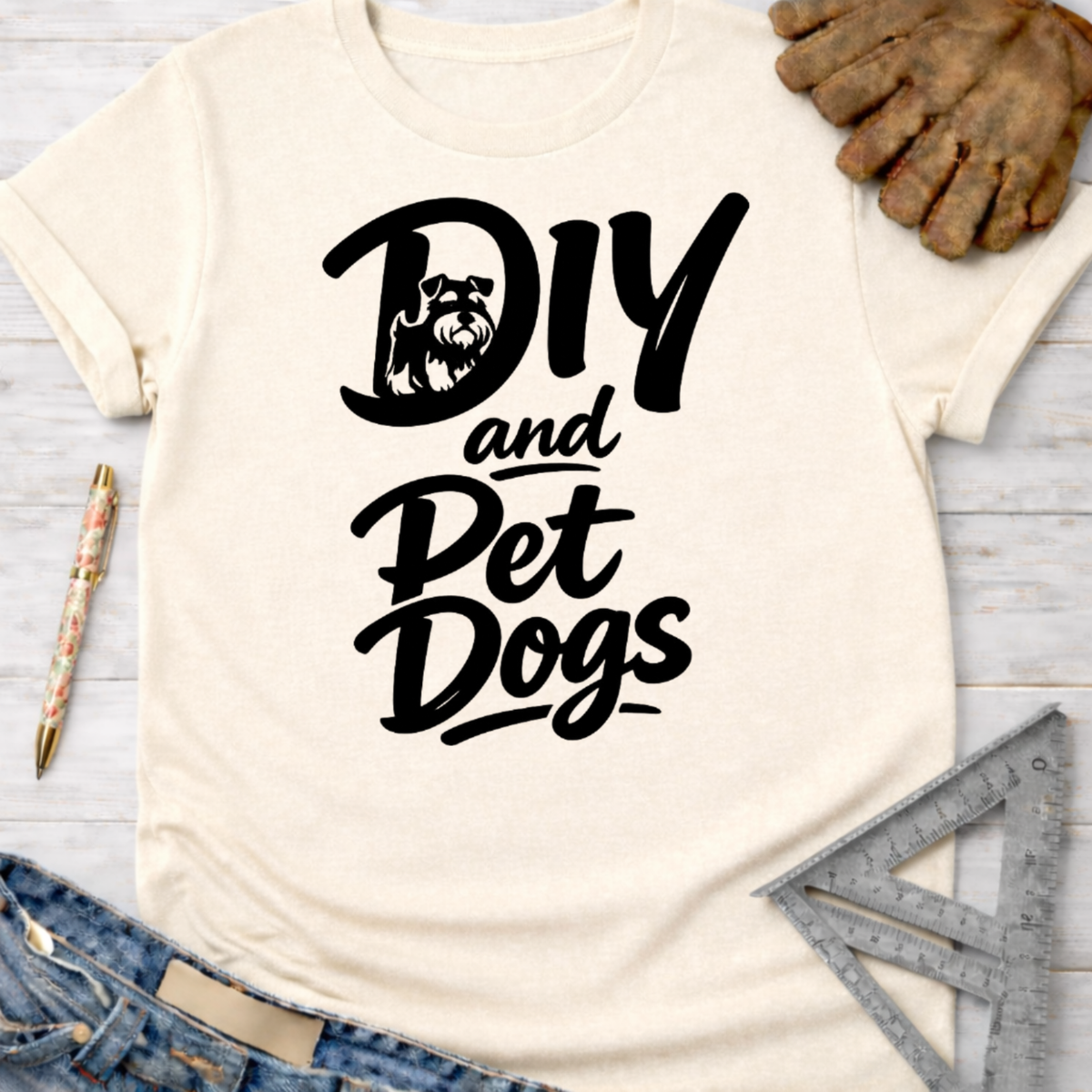 Women's funny woodworking graphic tee shirt for female woodworkers, makers, and DIY builders — Sawdust & Ponytails. Cream t-shirt with "DIY and Pet Dogs" black graphic featuring a Schnauzer.