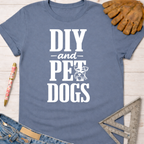 Women's funny woodworking graphic tee shirt for female woodworkers, makers, and DIY builders — Sawdust & Ponytails. Blue cotton tee with "DIY and Pet Dogs" graphic.