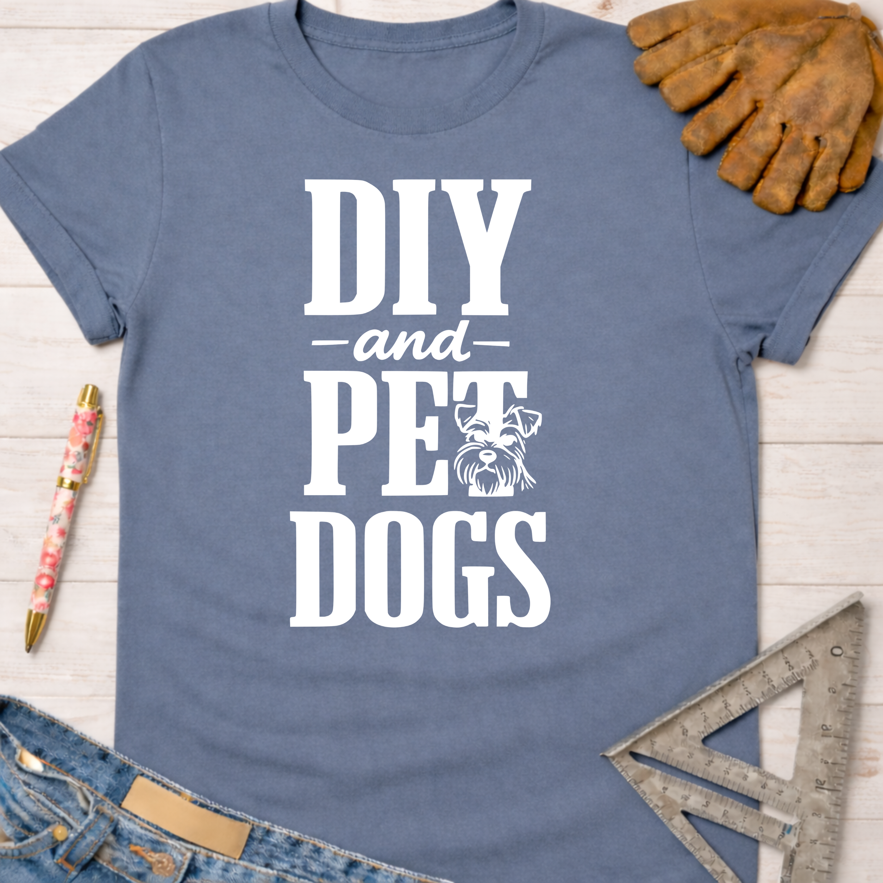 Women's funny woodworking graphic tee shirt for female woodworkers, makers, and DIY builders — Sawdust & Ponytails. Blue cotton tee with "DIY and Pet Dogs" graphic.