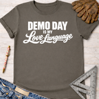 Charcoal gray cotton women's "Demo Day Is My Love Language" graphic tee with rolled sleeves. Women's funny woodworking graphic tee shirt for female woodworkers, makers, and DIY builders — Sawdust & Ponytails