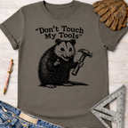 Women's funny woodworking graphic tee shirt for female woodworkers, makers, and DIY builders — Sawdust & Ponytails. Gray t-shirt with a possum holding a hammer and "Don't Touch My Tools" text.