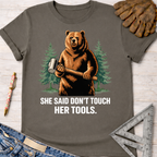 Charcoal gray cotton tee with a grizzly bear holding a mallet and "SHE SAID DON'T TOUCH HER TOOLS." graphic. Women's funny woodworking graphic tee shirt for female woodworkers, makers, and DIY builders — Sawdust & Ponytails