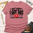 Pink t-shirt with "Don't Worry I Got This I Watched YouTube Videos" graphic.