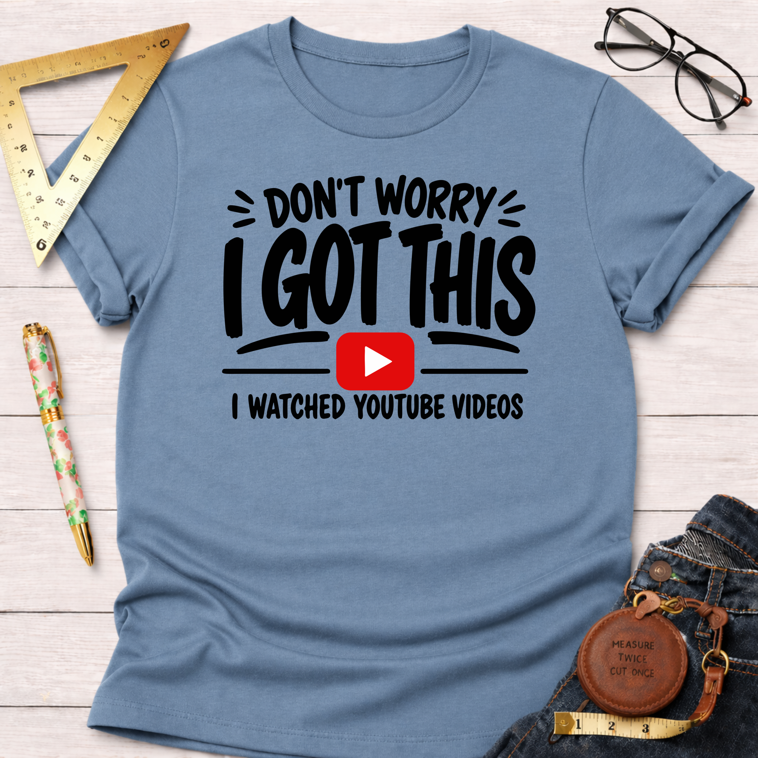Blue cotton t-shirt with "Don't Worry I Got This I Watched YouTube Videos" graphic.