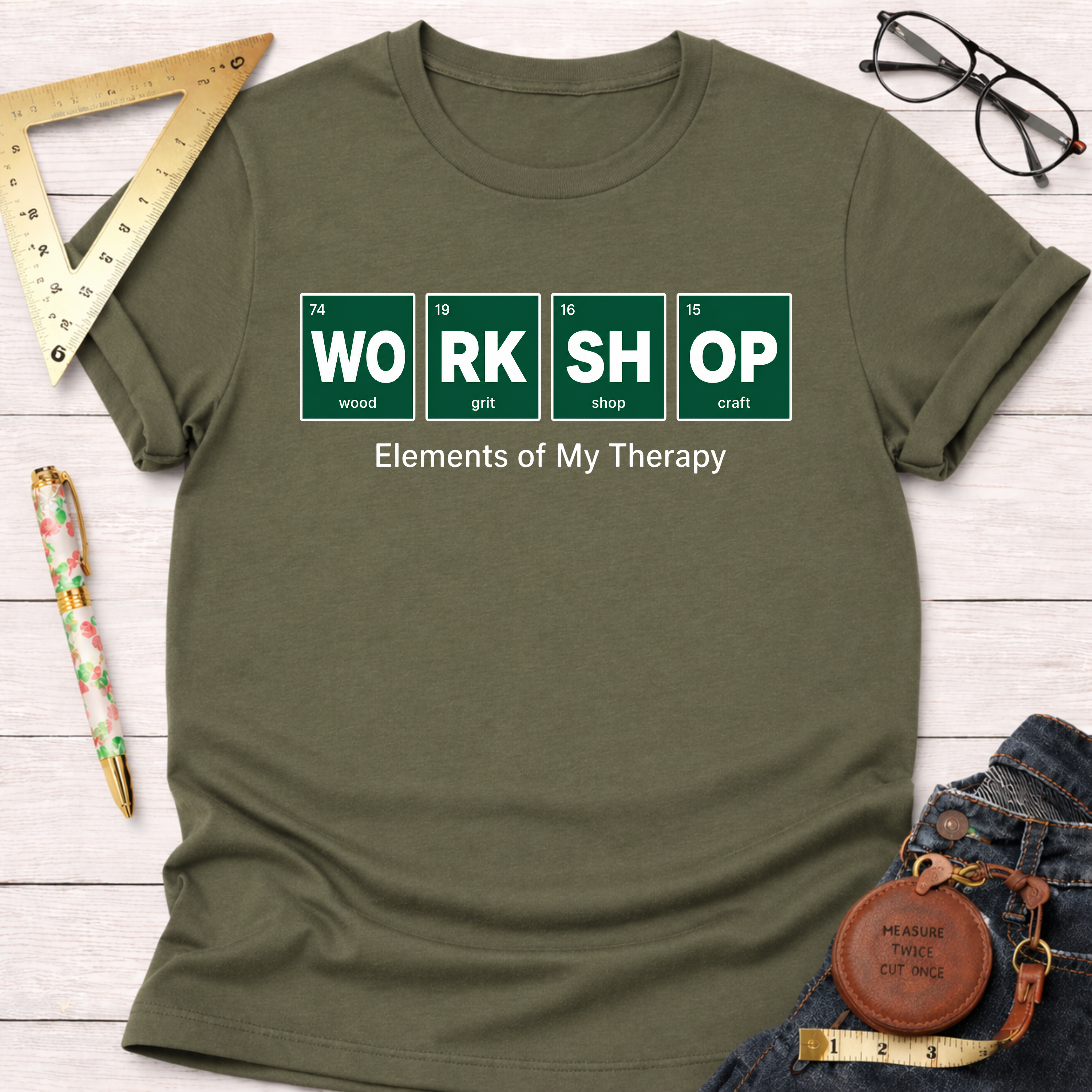 Olive green Elements T-shirt with "WORK SHOP" in periodic table style, "Elements of My Therapy" text.