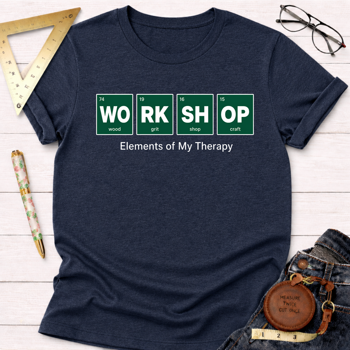 Navy blue Elements T-shirt with "WORK SHOP" in green periodic table style, "Elements of My Therapy" text.