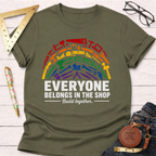 Olive green unisex t-shirt with a rainbow arc of diverse tools and "Everyone Belongs In The Shop" text.