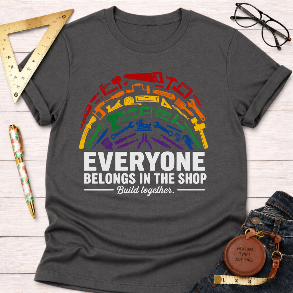Charcoal gray unisex t-shirt with a rainbow arc of diverse tools and "Everyone Belongs In The Shop Build together.